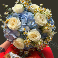 Blue Harmony” – White Roses, Blue Hydrangeas, Daisies, and Eucalyptus